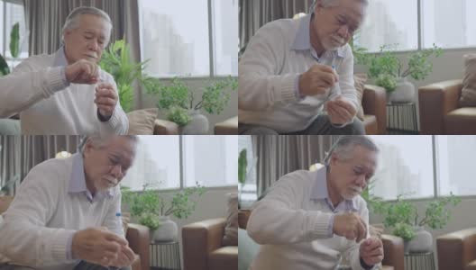 亚洲老年男性手鼻拭子检测快速检测自己在家隔离隔离SARS co-2病毒的概念高清在线视频素材下载