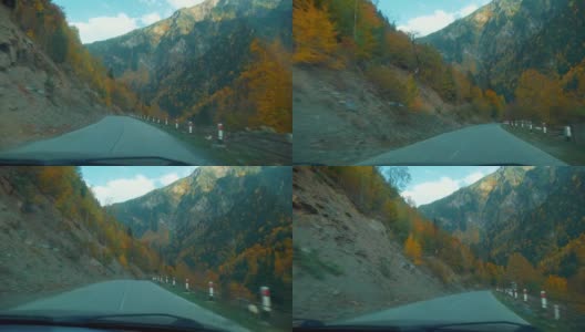 相机从第一人称拍摄，汽车沿着一条狭窄的山路行驶。高清在线视频素材下载