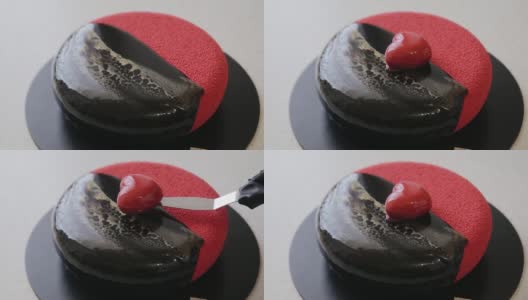 用心形慕斯蛋糕装饰丝绒涂层蛋糕。情人节的蛋糕。黑色和红色的蛋糕高清在线视频素材下载