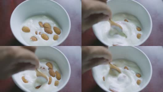 搅拌杏仁和酸奶高清在线视频素材下载