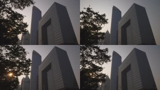 日落时分青岛市区现代办公大楼前慢镜头全景4k中国高清在线视频素材下载