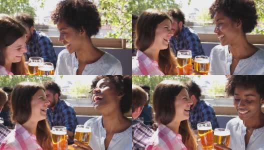 一群人在酒吧里开怀大笑，喝着啤酒非常开心高清在线视频素材下载