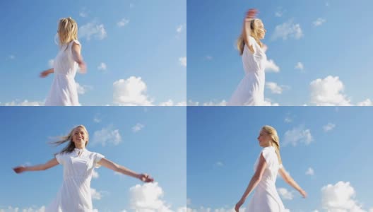 微笑的年轻女子在白色的裙子在蓝色的天空高清在线视频素材下载