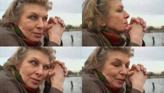 特写视频肖像美丽的50岁的女人与复杂的情绪在脸上。高清在线视频素材下载