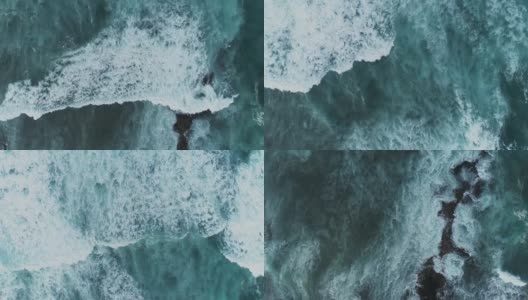 空中的慢动作镜头海浪冲向岩石海岸高清在线视频素材下载