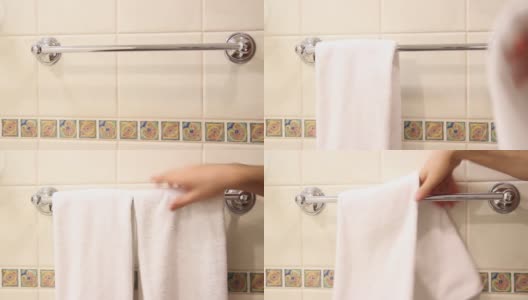 管家把干净的浴巾放在浴室的特写镜头高清在线视频素材下载