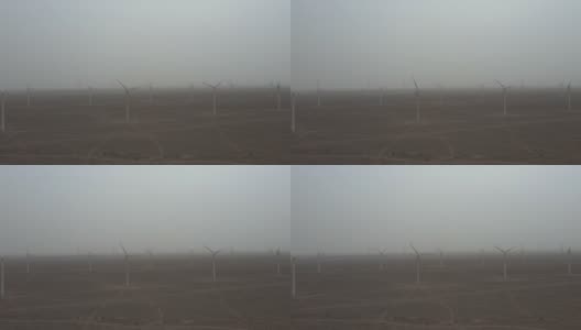沙尘暴中的风力涡轮机高清在线视频素材下载