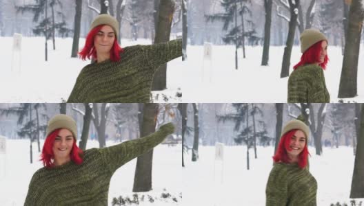 顽皮的红发女郎在雪地上打转高清在线视频素材下载