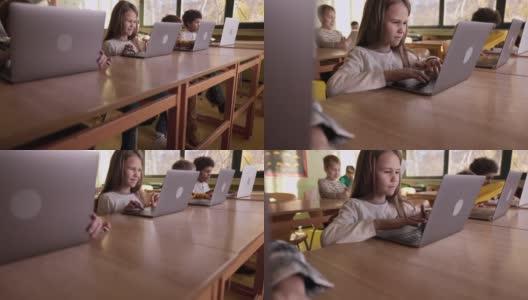 数字原住民学生在小学使用电脑。高清在线视频素材下载