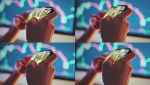 B卷-女人的手在手机上玩区块链nft游戏的价格图表数字交换的背景。高清在线视频素材下载