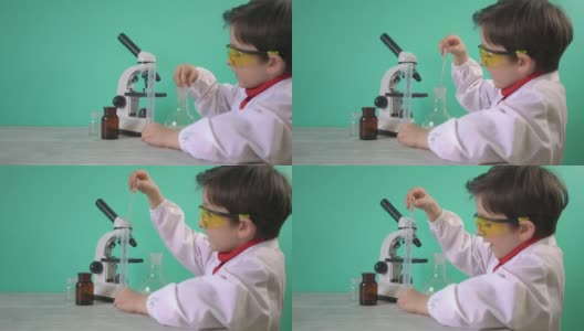 小男孩用液体做化学实验高清在线视频素材下载