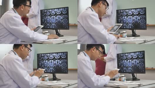 医生在电脑上检查影像x射线核磁共振高清在线视频素材下载