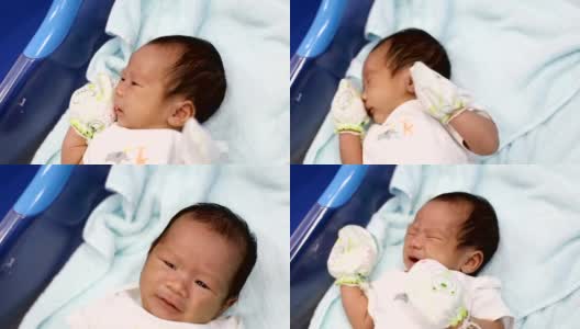 亚洲新生儿躺在医院产房的床上高清在线视频素材下载