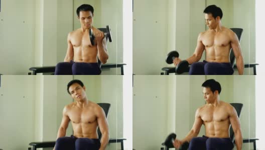 年轻的亚洲健美者在健身房用哑铃练习，健康和生活方式的概念高清在线视频素材下载