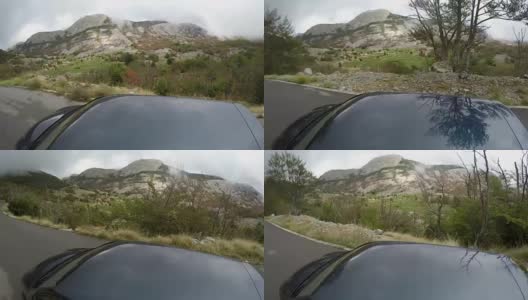 汽车行驶在林间的山路上高清在线视频素材下载