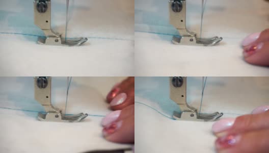 专业缝纫机，中年妇女的手高清在线视频素材下载