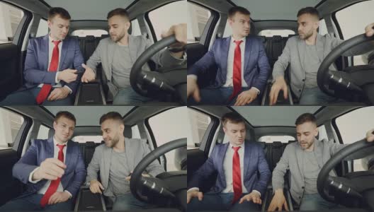 汽车经销商正在给愉快的男买家钥匙卡，男人们在试驾后坐在车内握手、微笑、交谈。购买交通和人的概念。高清在线视频素材下载