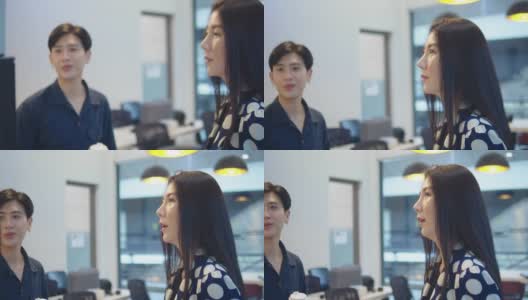 一对年轻的亚洲商业夫妇在一个创意办公室高清在线视频素材下载