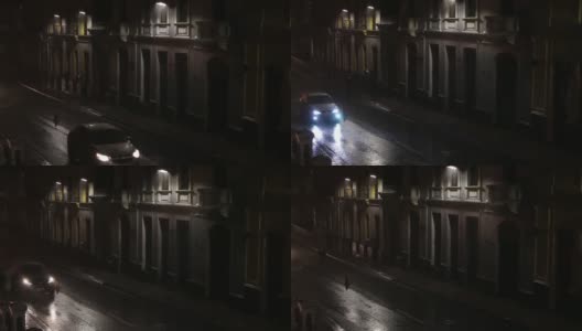 黑暗的街道，很少有路灯，在漆黑的夜晚，人们在大雨中奔跑高清在线视频素材下载