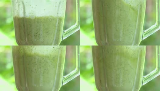 水果和蔬菜混合健康的绿色奶昔。香蕉莳萝冰沙高清在线视频素材下载