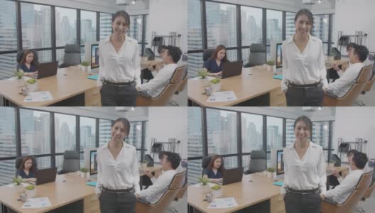 4K分辨率4K分辨率肖像的年轻亚洲商务女性站在商业团队在室内现代办公室，亚洲商务办公室生活高清在线视频素材下载