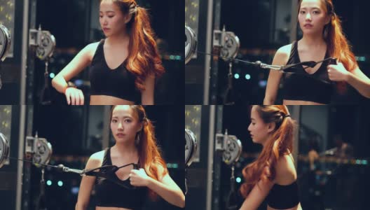 年轻的亚洲女人在锻炼手臂机器高清在线视频素材下载