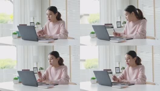 年轻有吸引力的商业亚洲女人谈论销售报告在视频电话会议上笔记本电脑在线会议在家工作，远程工作和社会隔离的概念。高清在线视频素材下载
