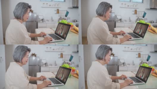 亚洲资深女性视频电话与医生在客厅在家。老年病人咨询全科医生应用电脑。医生和顾问在线和远程医疗的概念。高清在线视频素材下载