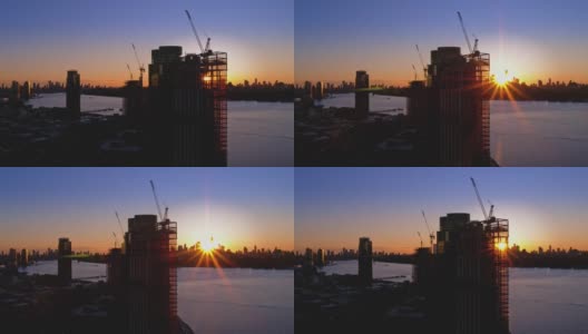 布鲁克林滨水区新建住宅楼，可以看到曼哈顿的天际线。航拍视频与平移摄像机运动。高清在线视频素材下载