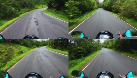 骑摩托车在弯弯曲曲的山路上与郁郁葱葱的森林夹在一起高清在线视频素材下载
