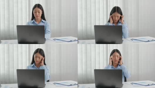 亚洲女性感觉压力和疲惫的工作在办公室的努力高清在线视频素材下载