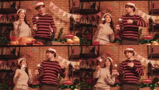 两个朋友在烟花中跳舞，庆祝圣诞晚会。高清在线视频素材下载