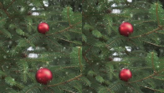 圣诞树上的红色小玩意，周围飘着雪花高清在线视频素材下载