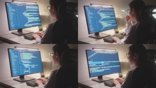 开发人员程序员在晚上工作在计算机代码高清在线视频素材下载