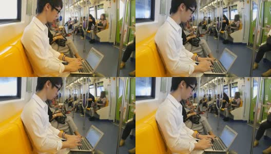 在火车上工作的年轻人高清在线视频素材下载