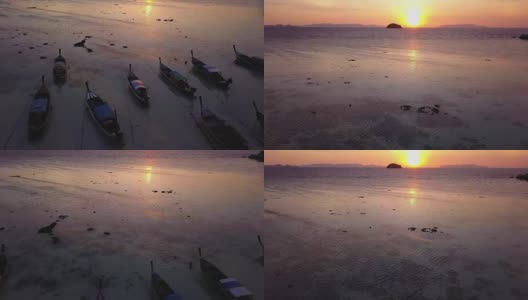 鸟瞰图跟踪长尾船和岩石海岸与水晶清澈的绿松石水Koh Lipe, Satun，泰国高清在线视频素材下载