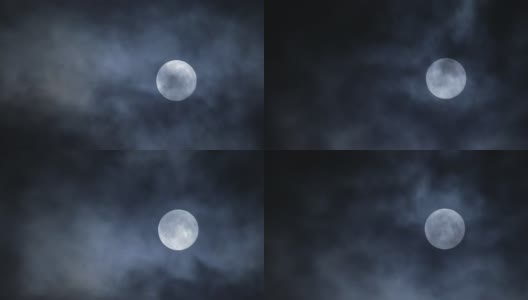 满月隐藏在黑暗的夜空背景云高清在线视频素材下载