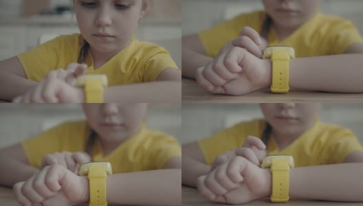 孩子使用她的孩子智能手表高清在线视频素材下载
