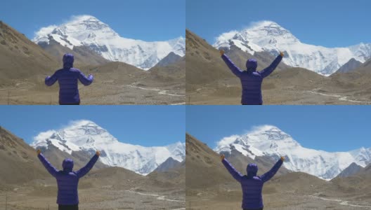 慢镜头徒步者在观察珠穆朗玛峰时成功地伸出双臂高清在线视频素材下载