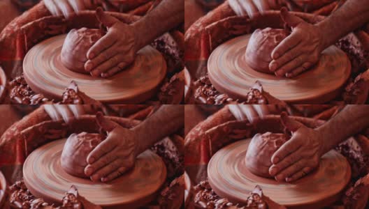 男性的手在陶工车轮上雕刻陶瓷的特写高清在线视频素材下载