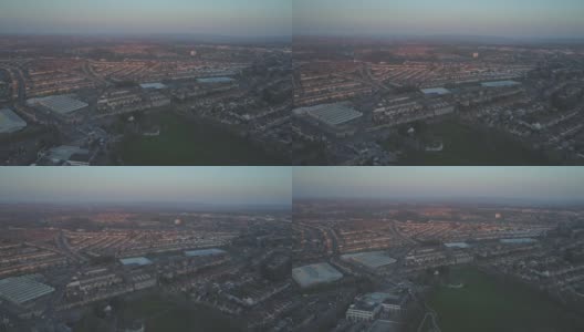 英国南布里斯托尔(South Bristol)郊区住宅的日落航拍，前景是阿诺河谷(Arnos Vale)高清在线视频素材下载