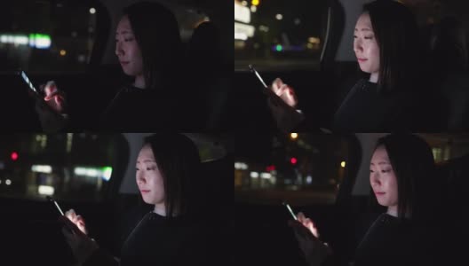 年轻的日本女子在晚上的出租车上使用智能手机高清在线视频素材下载