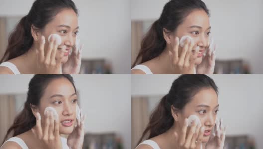 美丽的亚洲女性用水洗脸洗脸。高清在线视频素材下载