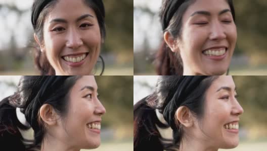 微笑美丽的亚洲中年妇女在公园摆姿势高清在线视频素材下载