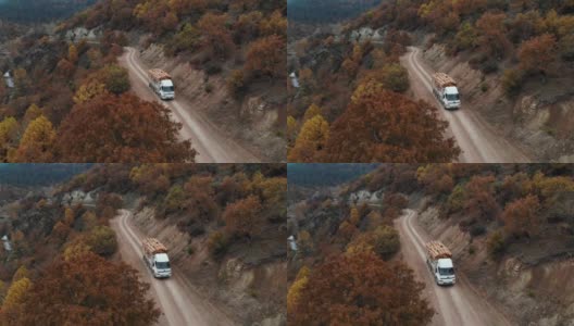 木材车行驶在土路上高清在线视频素材下载
