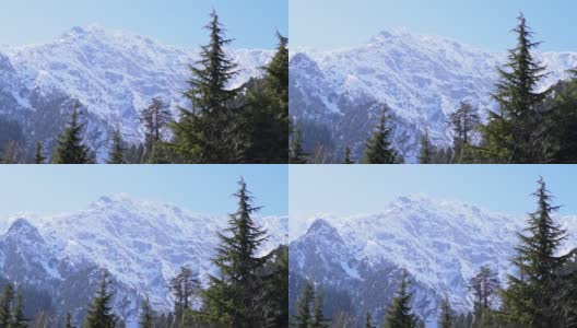 从印度喜马偕尔邦马纳里的索朗山谷看，山顶被雪覆盖高清在线视频素材下载