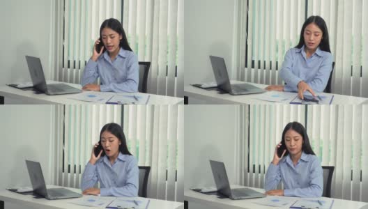 亚洲经理正在与一名员工通电话，对办公室错误的文书工作感到愤怒。高清在线视频素材下载