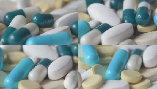 药物绿色和黄色的片剂或胶囊在白色的背景上高清在线视频素材下载