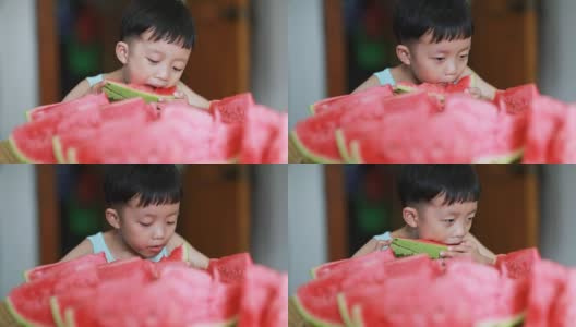可爱的亚洲宝宝吃西瓜高清在线视频素材下载