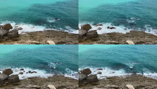 碧绿的海浪拍打着岩石，从山顶俯瞰高清在线视频素材下载